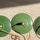Trio of vintage green enamelled sheet metal lampshade pendants