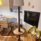 Oak floor lamp made of turned wood.