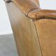 Sheep leather wingback chair with patina