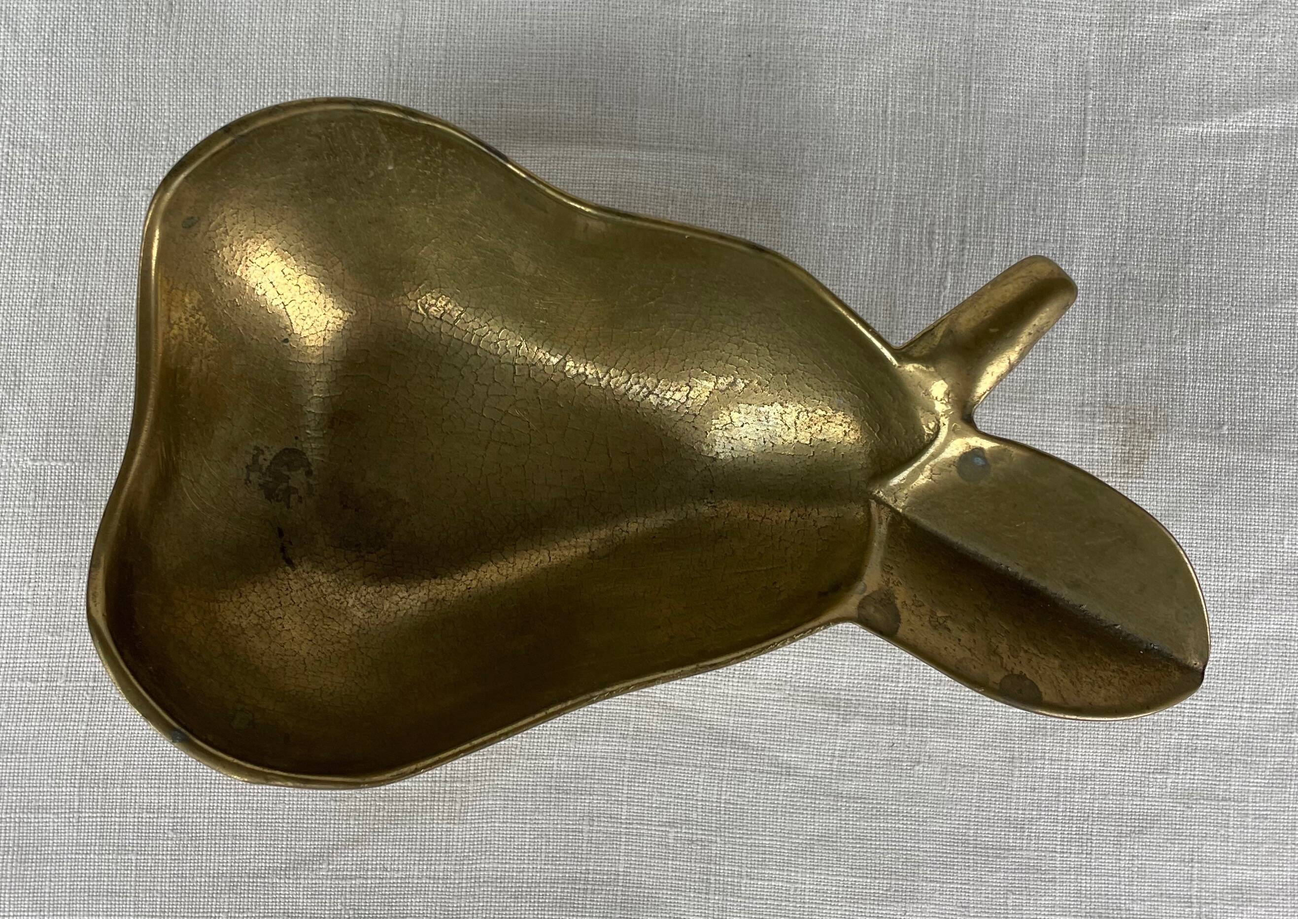 Empty pocket ashtray in pear-shaped brass