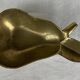 Empty pocket ashtray in pear-shaped brass