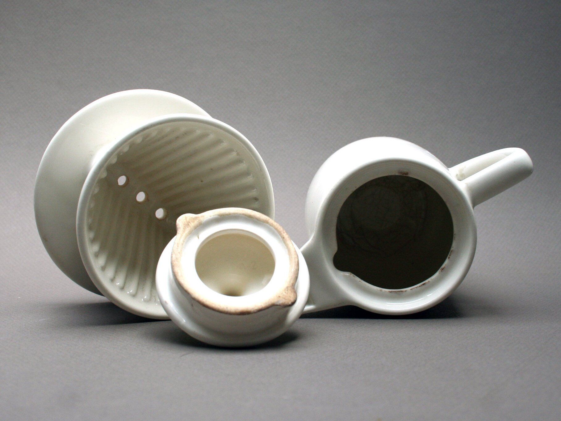 White ceramic coffeemaker and melitta filter, 60 years