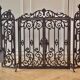 Wrought iron fire screen set with log basket, accessories.