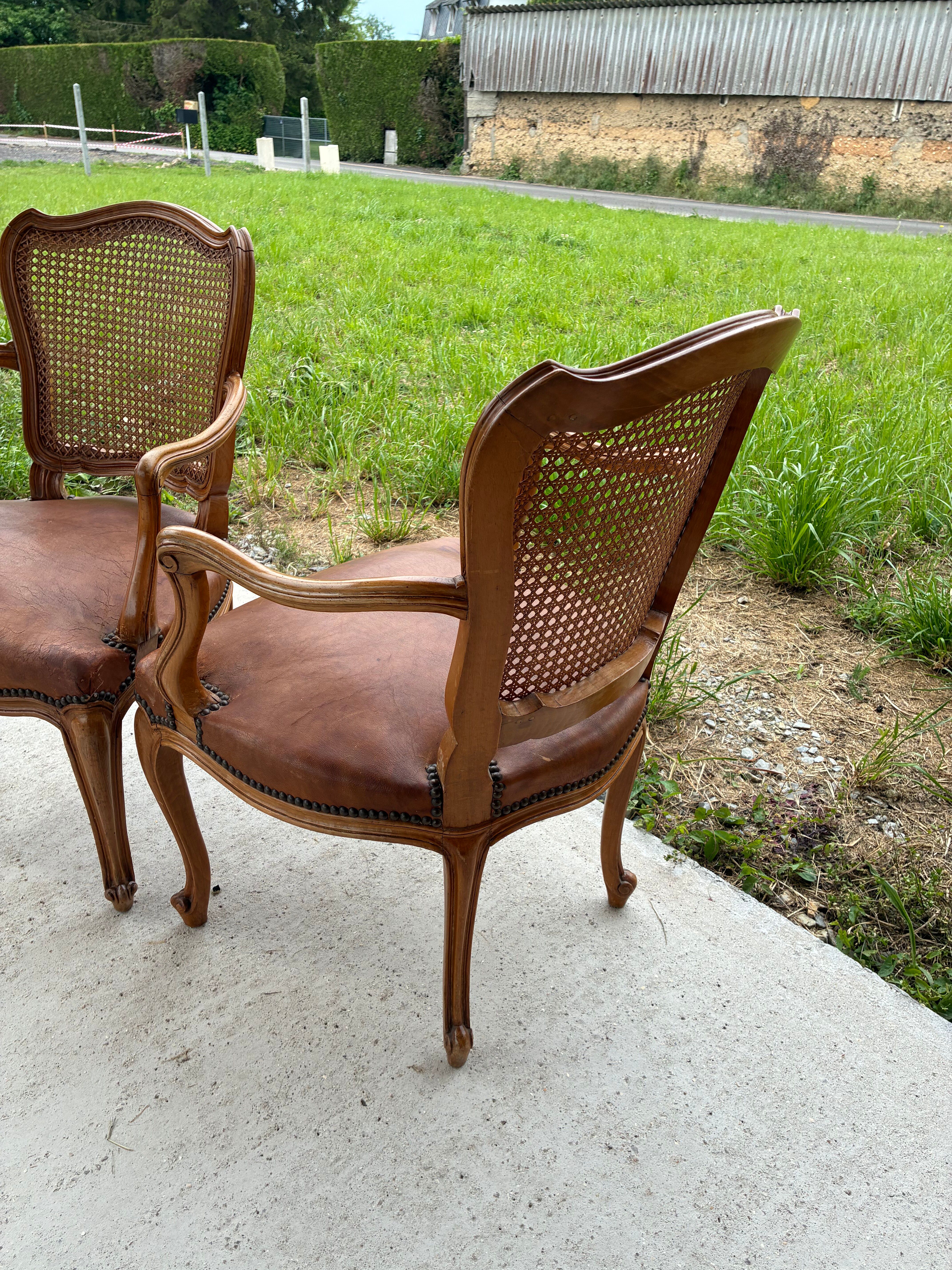 Cane and leather armchair in Louis XV style