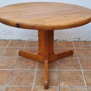 Scandinavian coffee table in solid pine with tripod legs in Swedish chalet style.