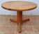 Scandinavian coffee table in solid pine with tripod legs in Swedish chalet style.