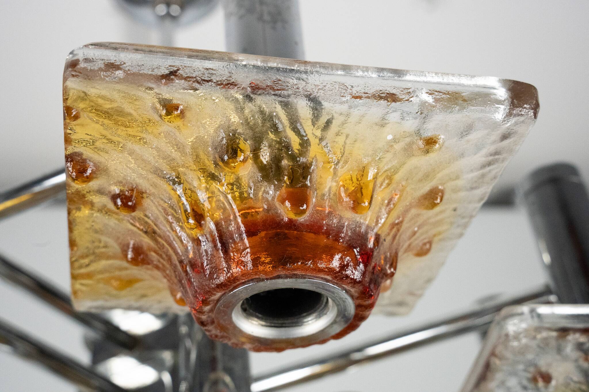 12-light Mazzega chandelier in amber and clear murano glass and chrome. Ita
