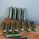 Poët Laval knife rest in emerald green ceramic and gold.