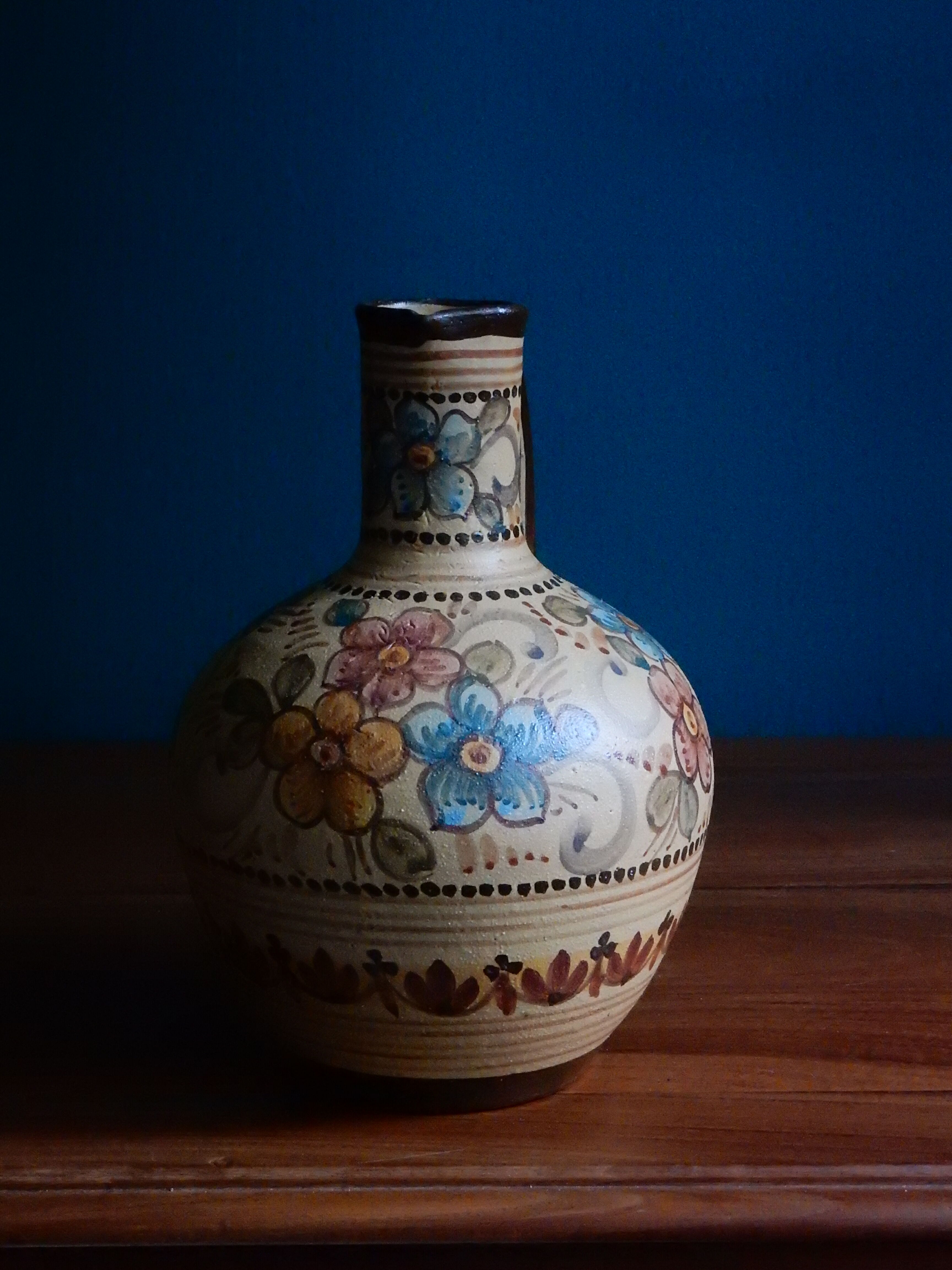 Hand-painted terracotta jug