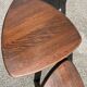 Nested tripod tables made of solid wood, in a modernist brutalist style.