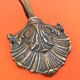 Patinated brass wall light with tulip shade