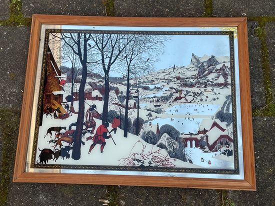 Vintage mirror painted hunters in the snow after painting by Pieter Bruegel the Elder (1565)