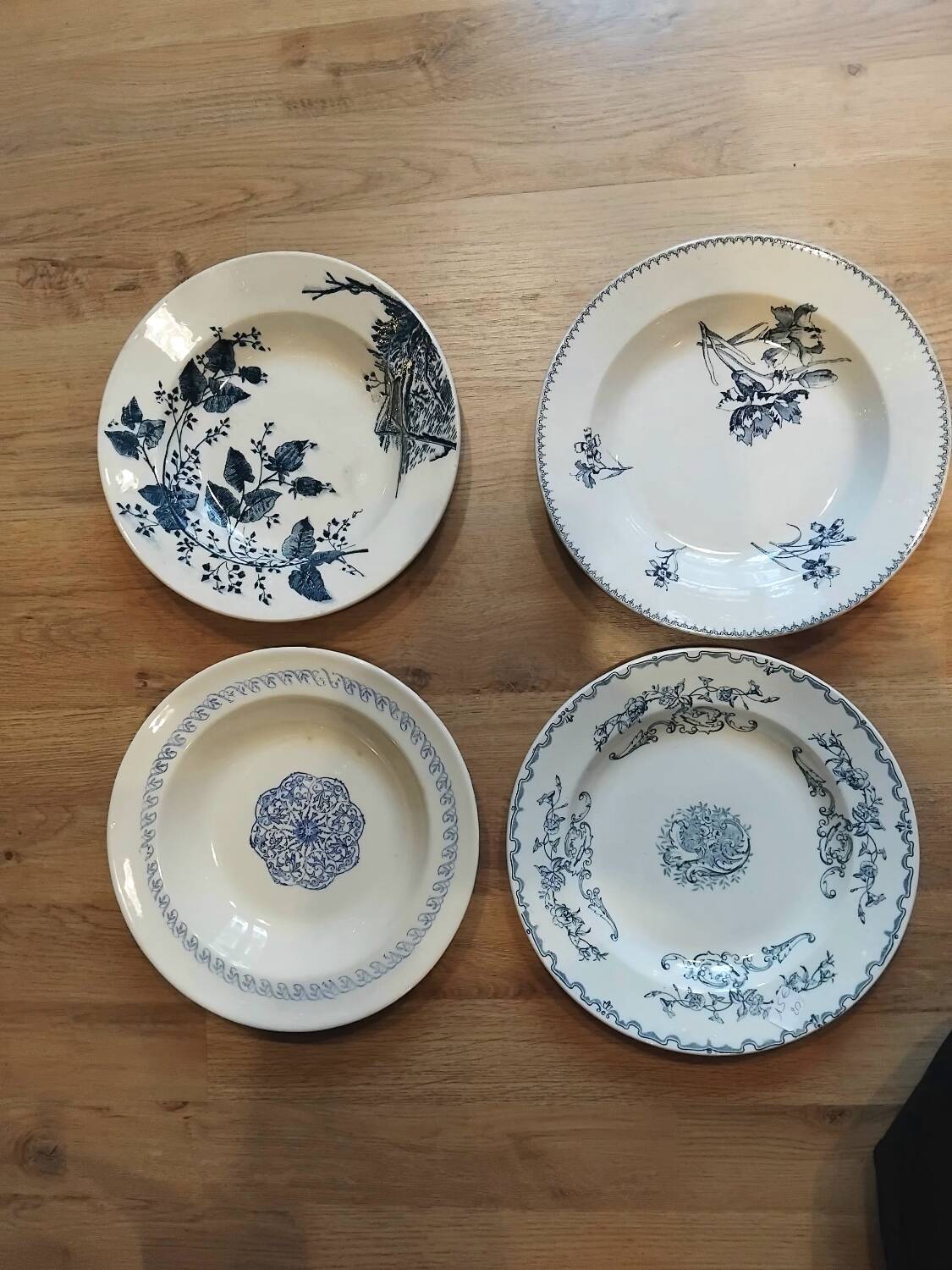 Set of 4 mismatched blue Terre de Fer soup plates