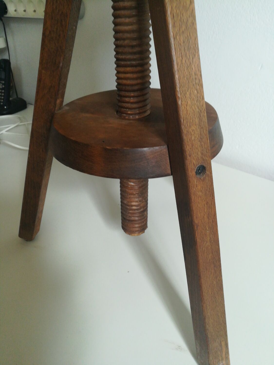 Old piano stool with screw