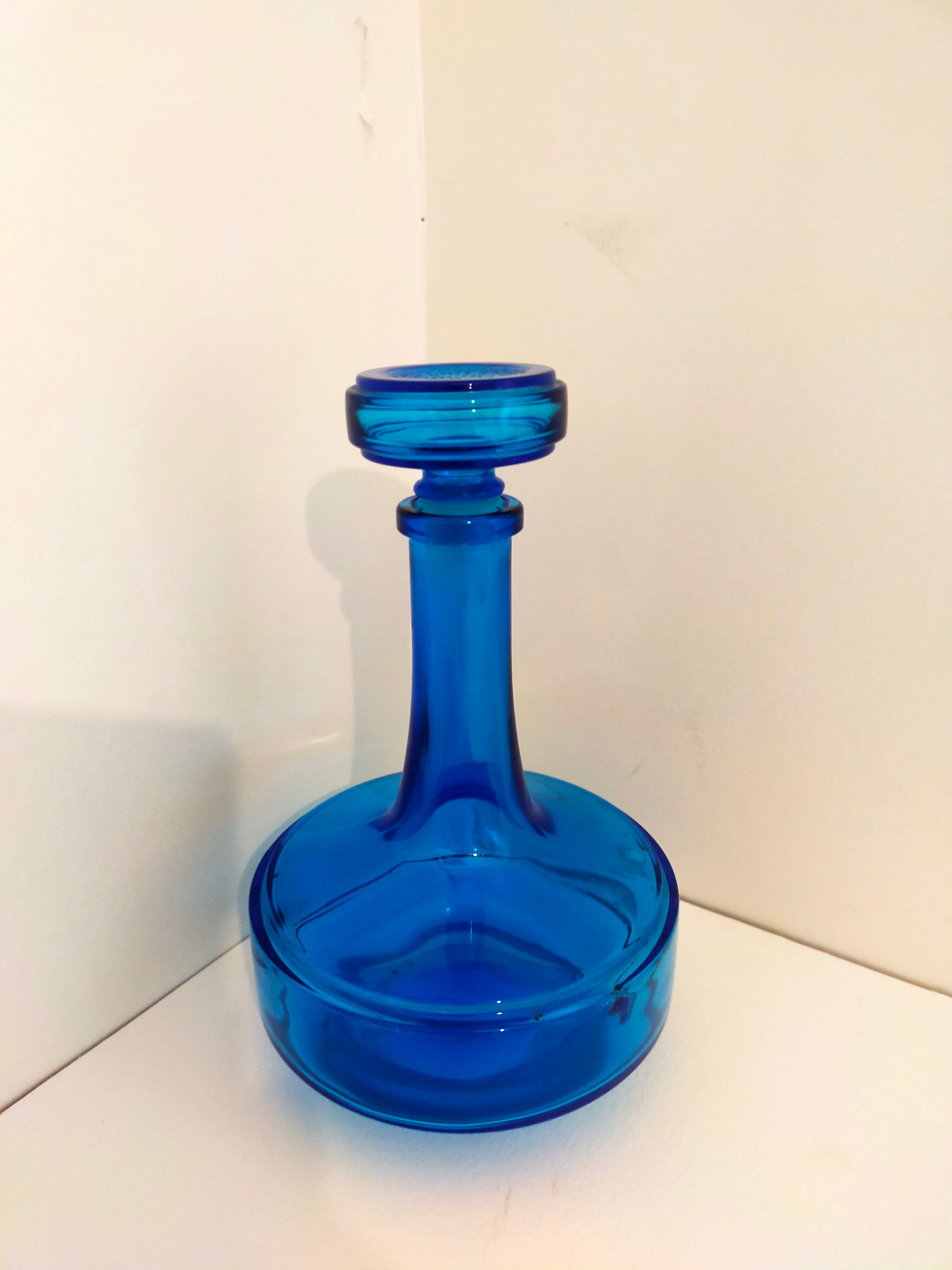 Bottle of old perfume of blue color