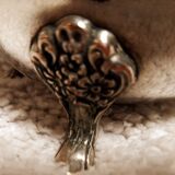 Silver-plated coffee and tea service including a coffee pot, a teapot, and a sugar bowl.