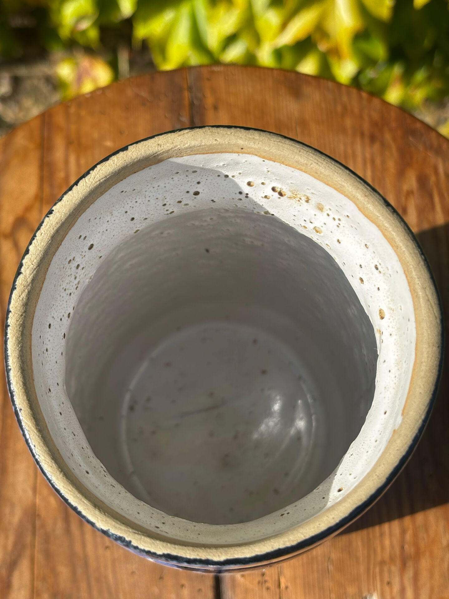 Pretty pot or vase in glazed stoneware with blue drip effect.