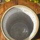 Pretty pot or vase in glazed stoneware with blue drip effect.