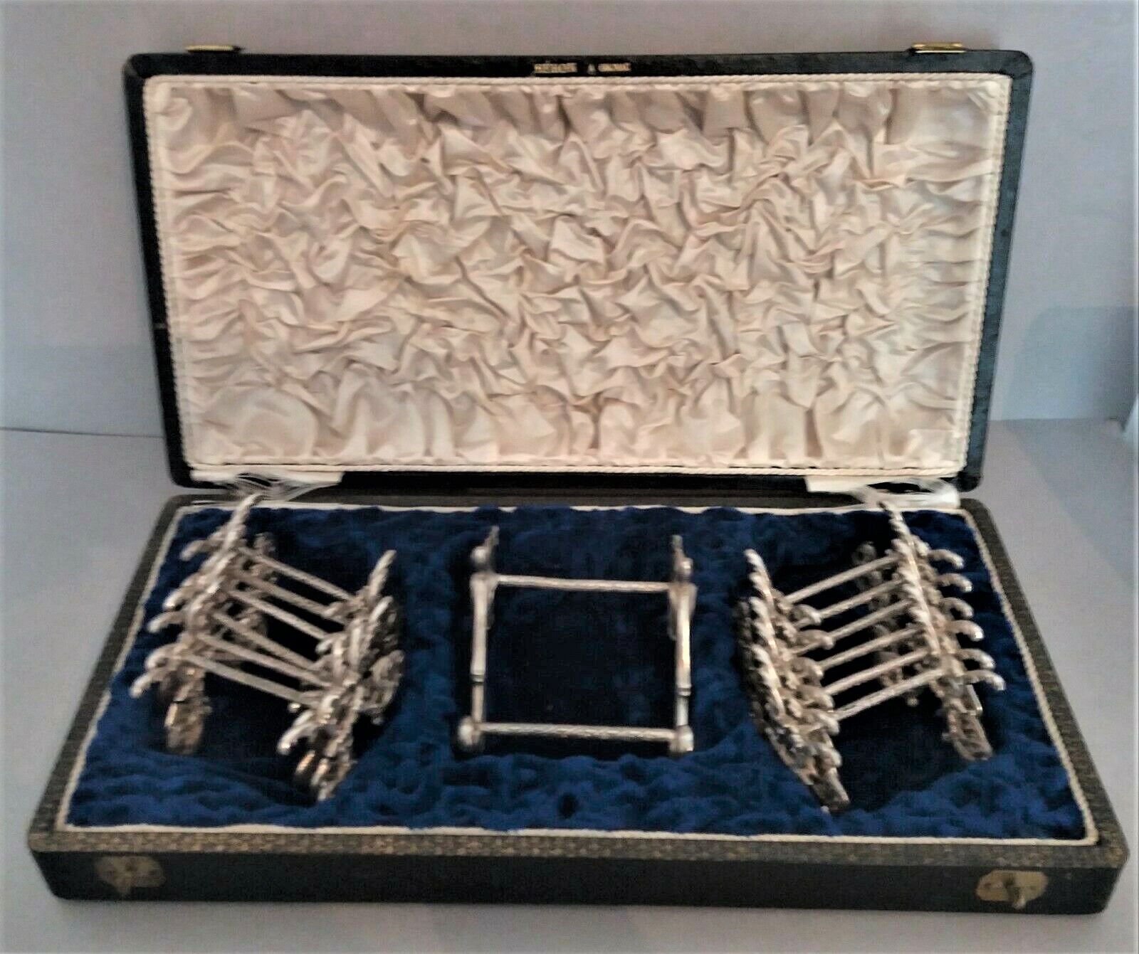 Twelve knife holders with ladle doors.