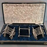 Twelve knife holders with ladle doors.