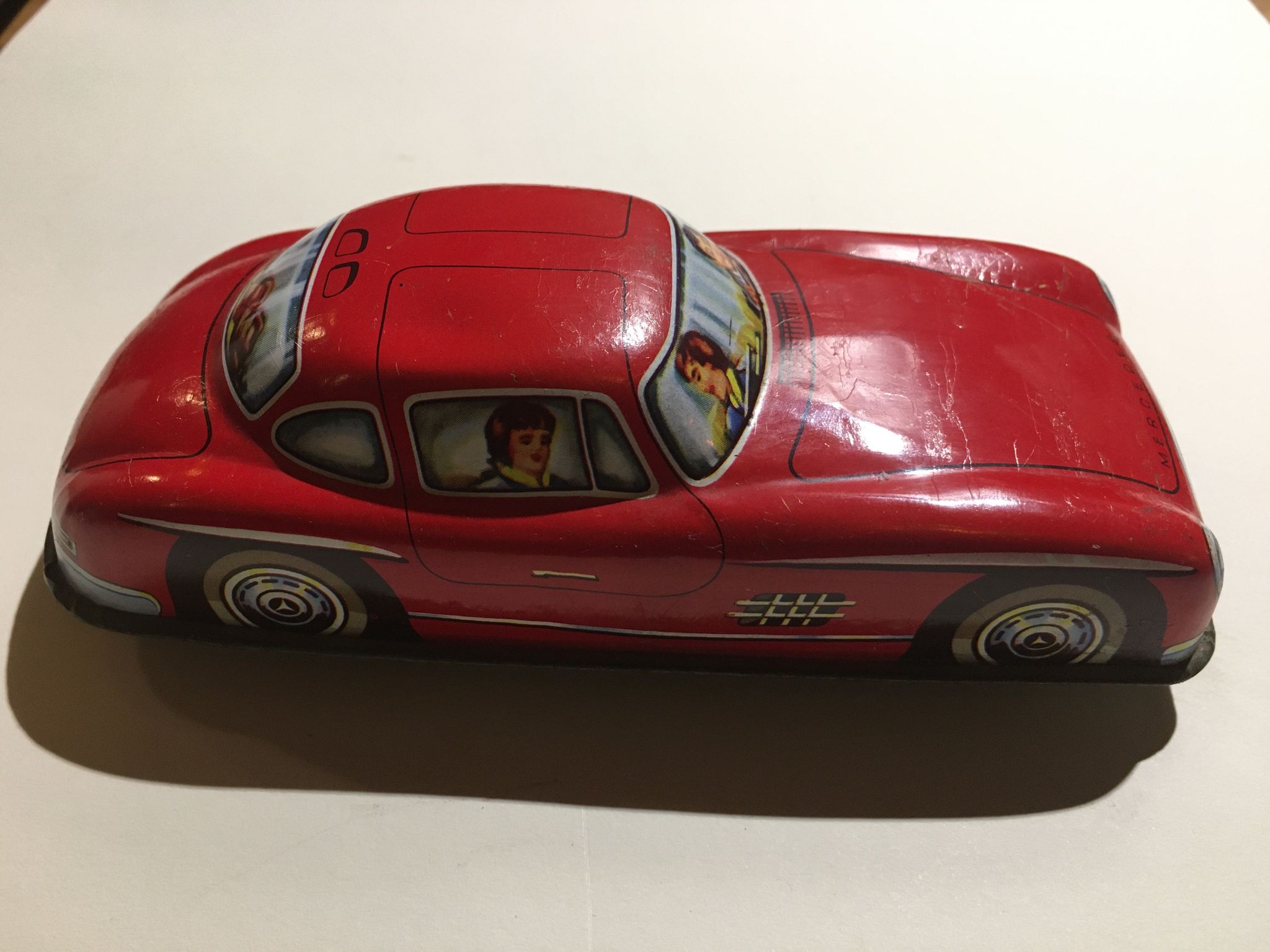Mercedes miniature car in lithographed sheet metal