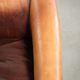 Vintage sheepskin club armchair finished with black piping