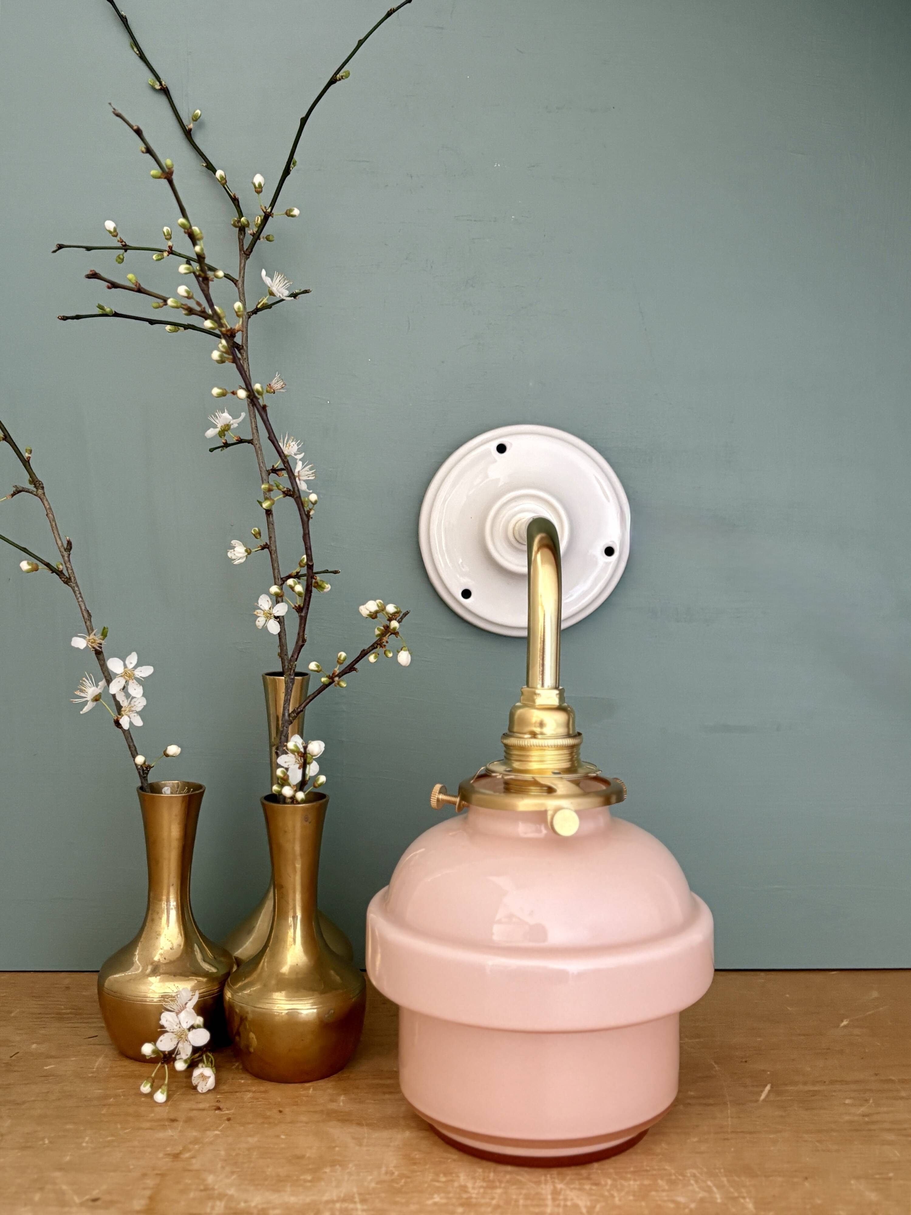 Vintage pink opaline globe wall light.