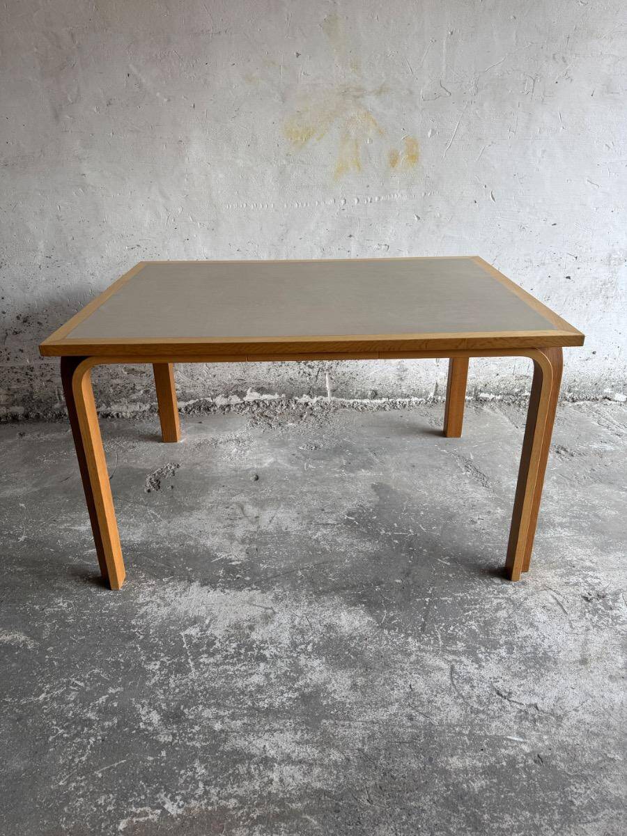 Magnus Olesen Danish dining table — light oak frame with recessed grey laminated top, 1970s