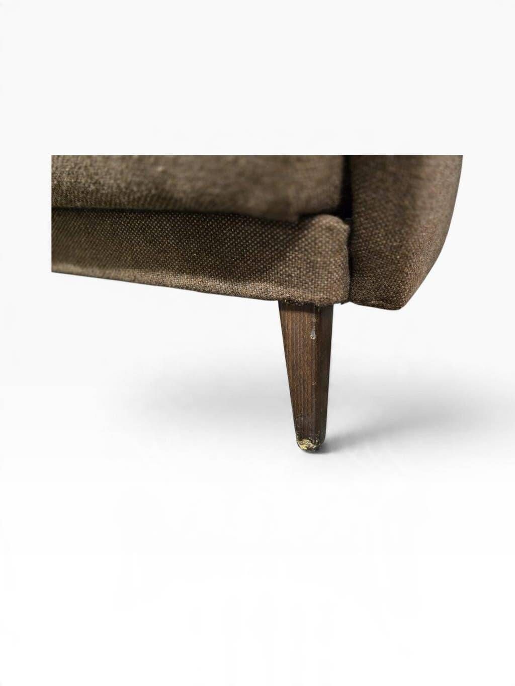 Vintage armchair/sofa/lounge in taupe colour with a stain.