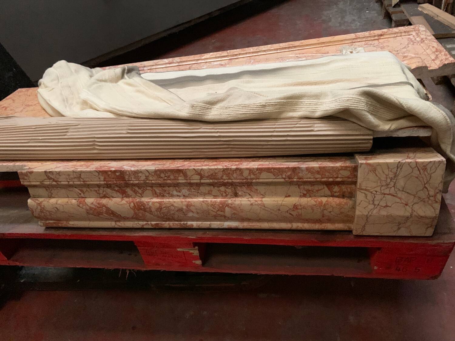 Louis XIV-style fireplace has 19th century veined pink marble hood