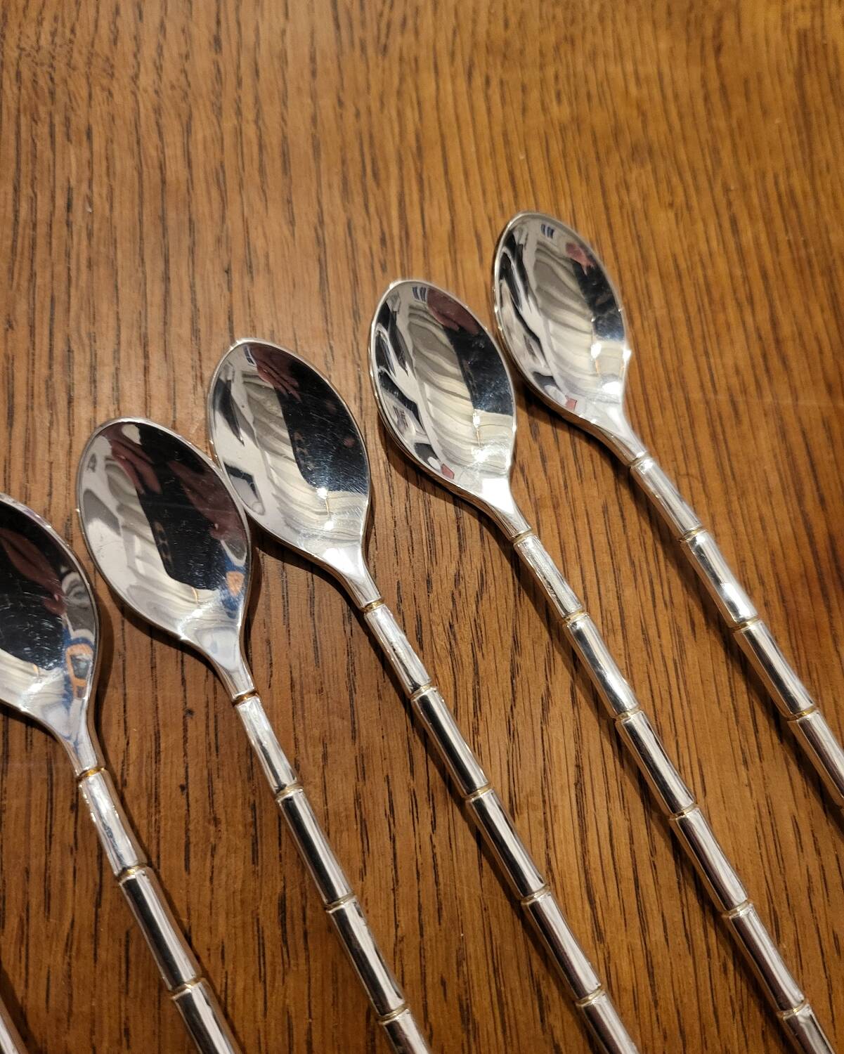 6 long silver-plated metal spoons