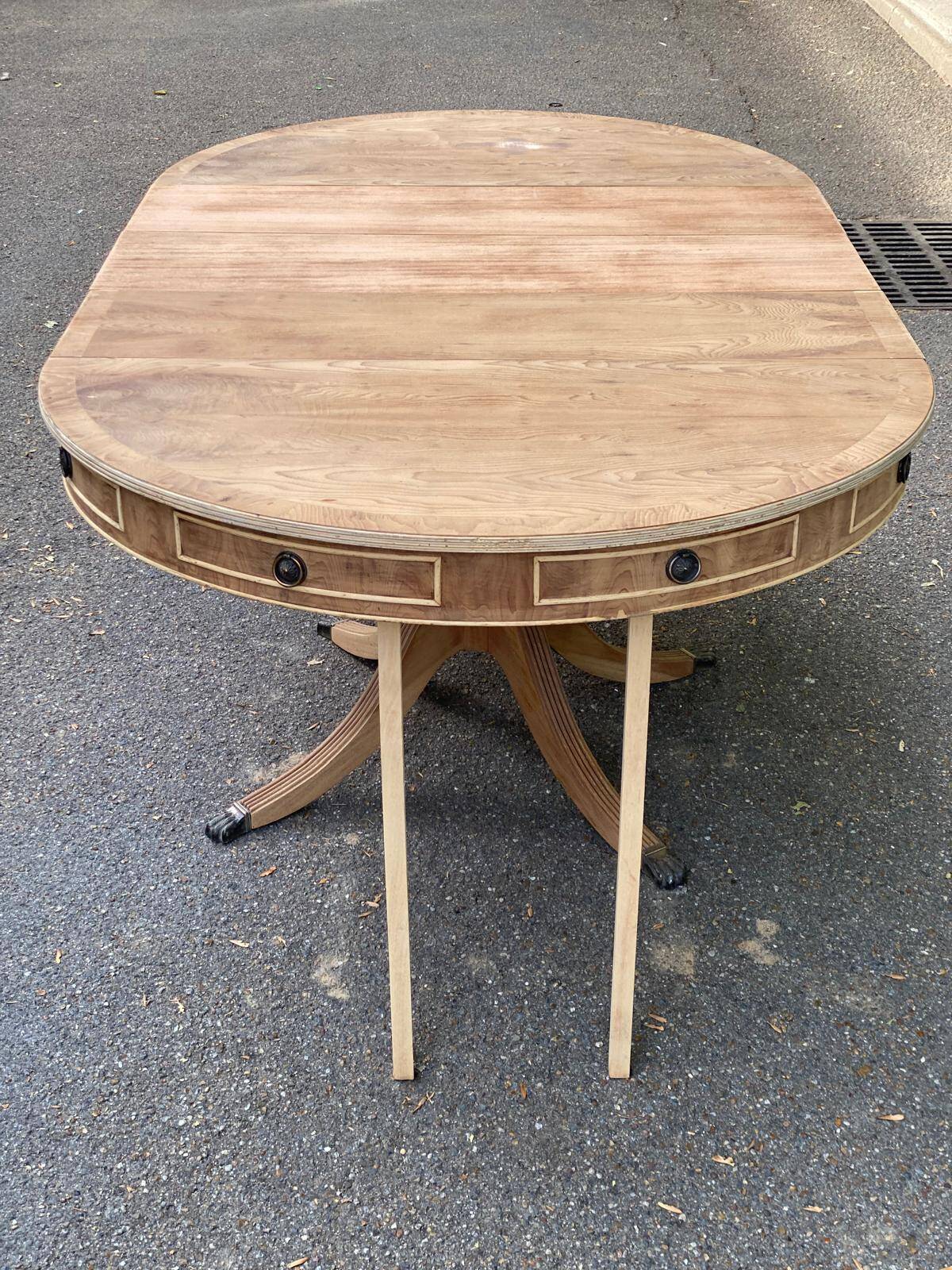 Round extendable dining table Regency central leg stripped mahogany 1960