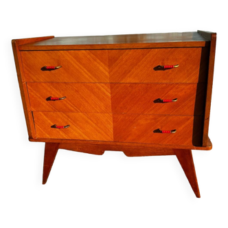 Vintage chest of drawers with compass feet.