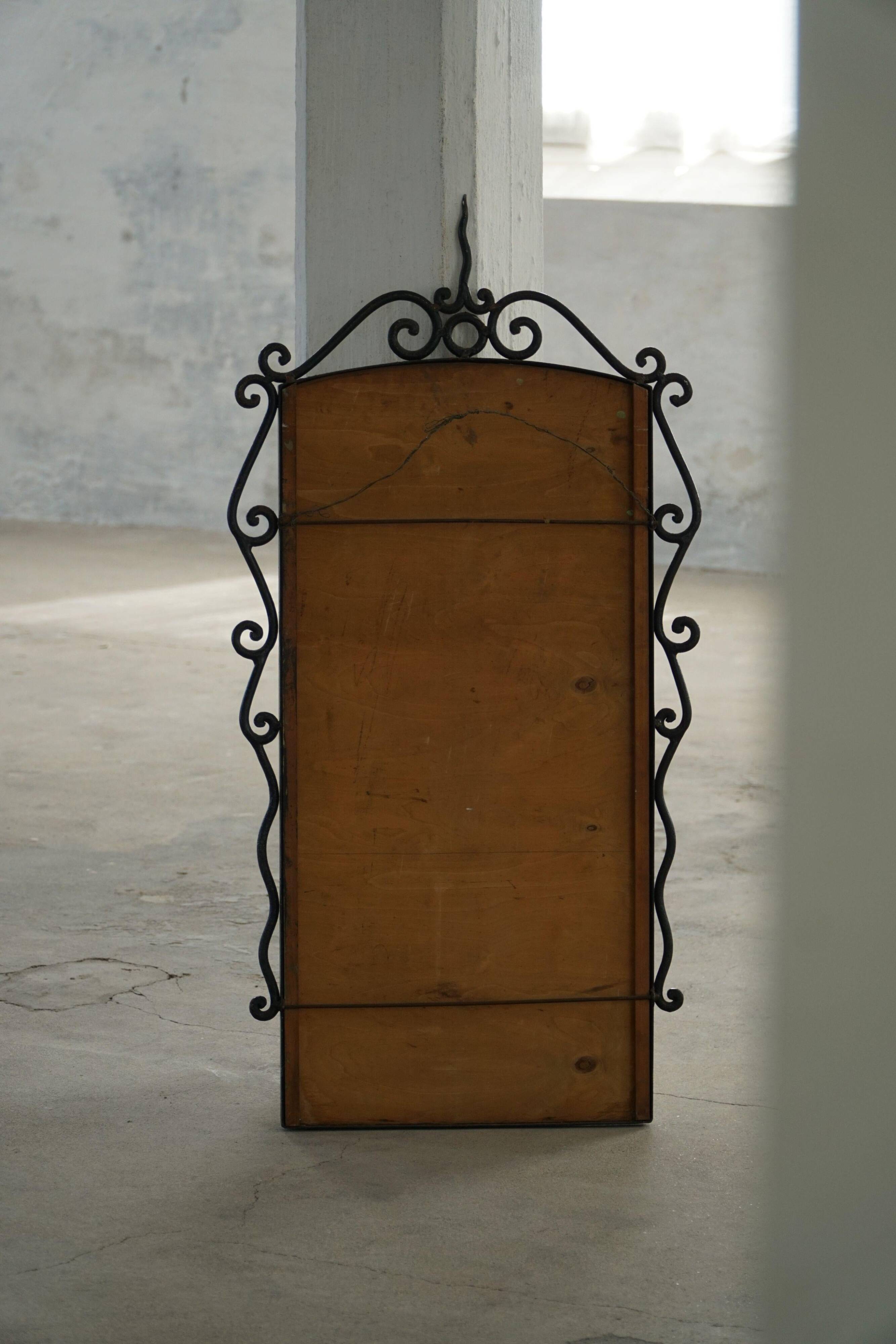 French mid-century brutalist wall mirror in wrought iron, made in the 1950s.