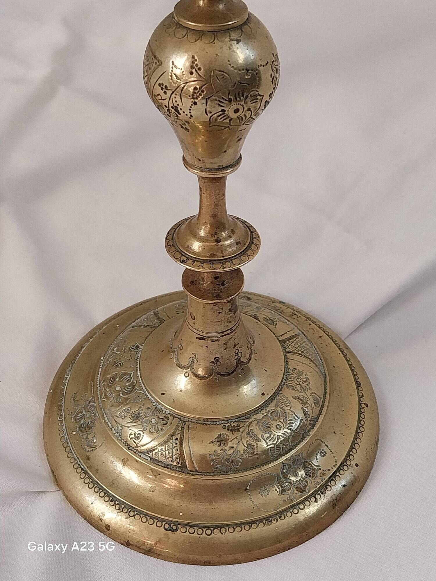 Pair of chiselled brass candelabra. Swedish craftsmanship, 20th century.