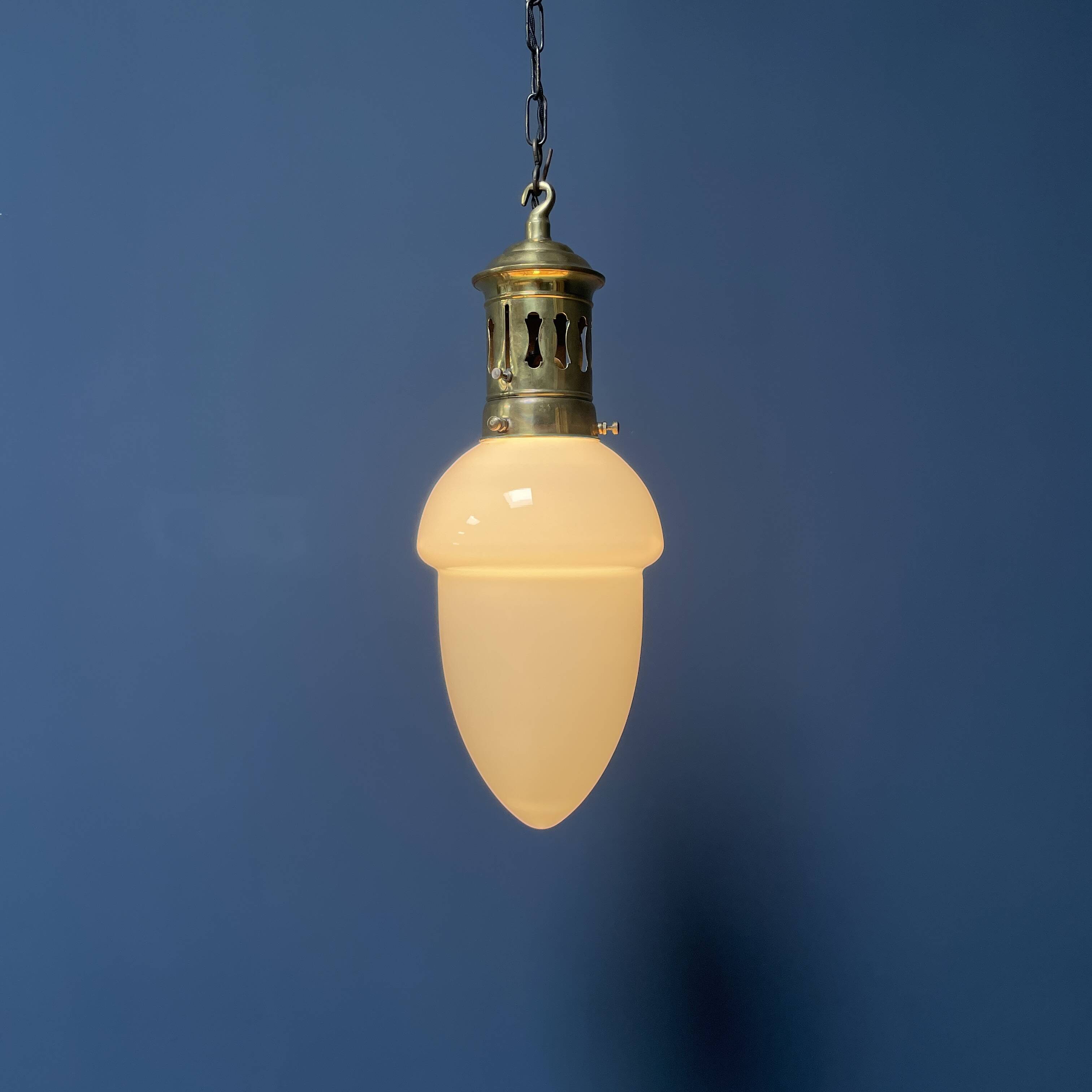 Opaline glass pendant lamp with elegant brass fixture