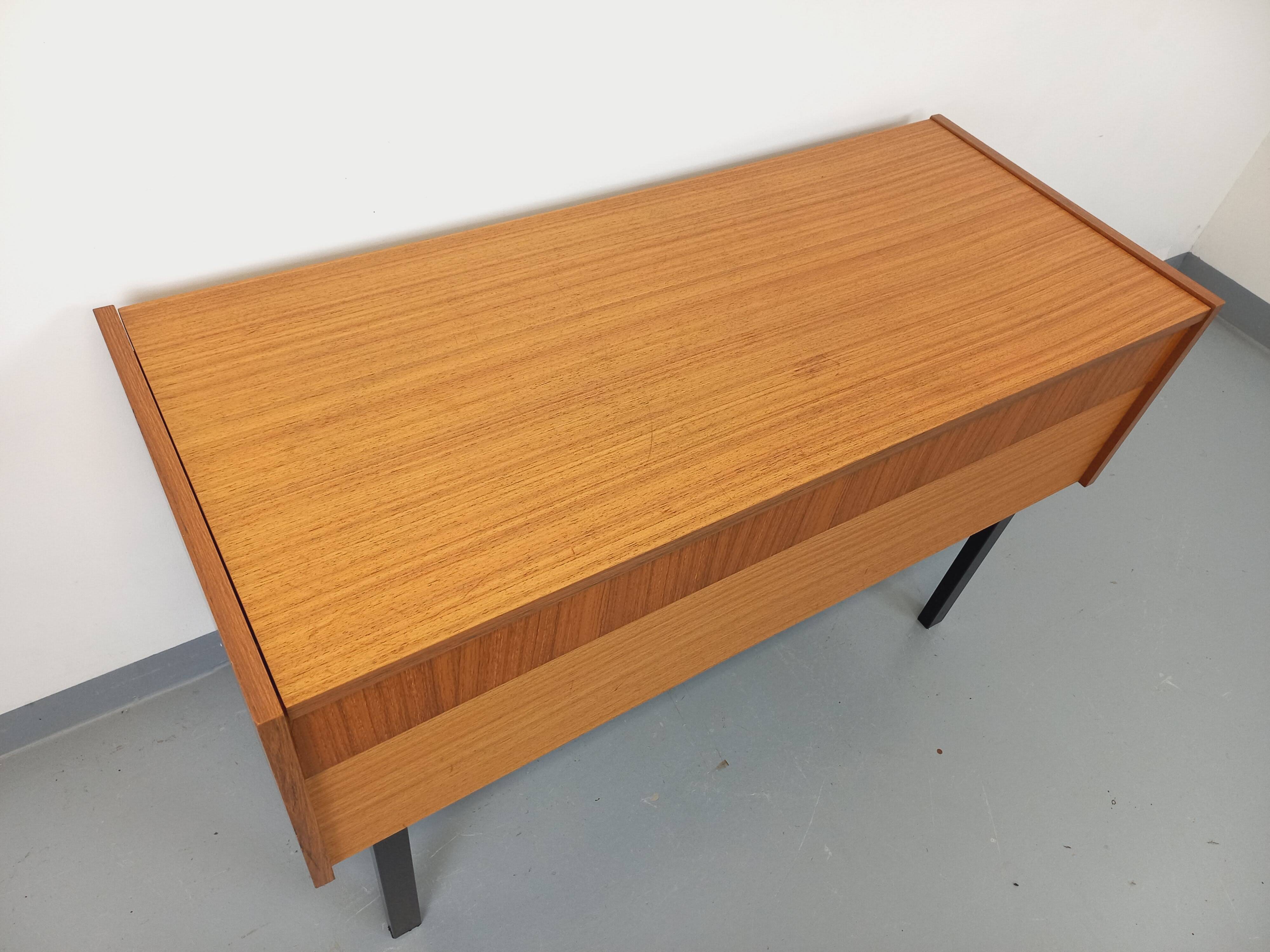 Vintage teak and black metal storage unit / chest on legs from the 70s