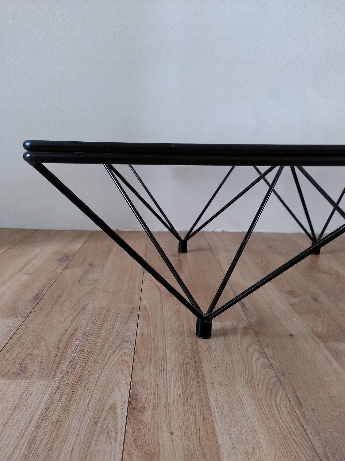 Glass coffee table with a metal frame.