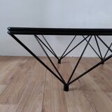 Glass coffee table with a metal frame.