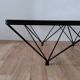 Glass coffee table with a metal frame.