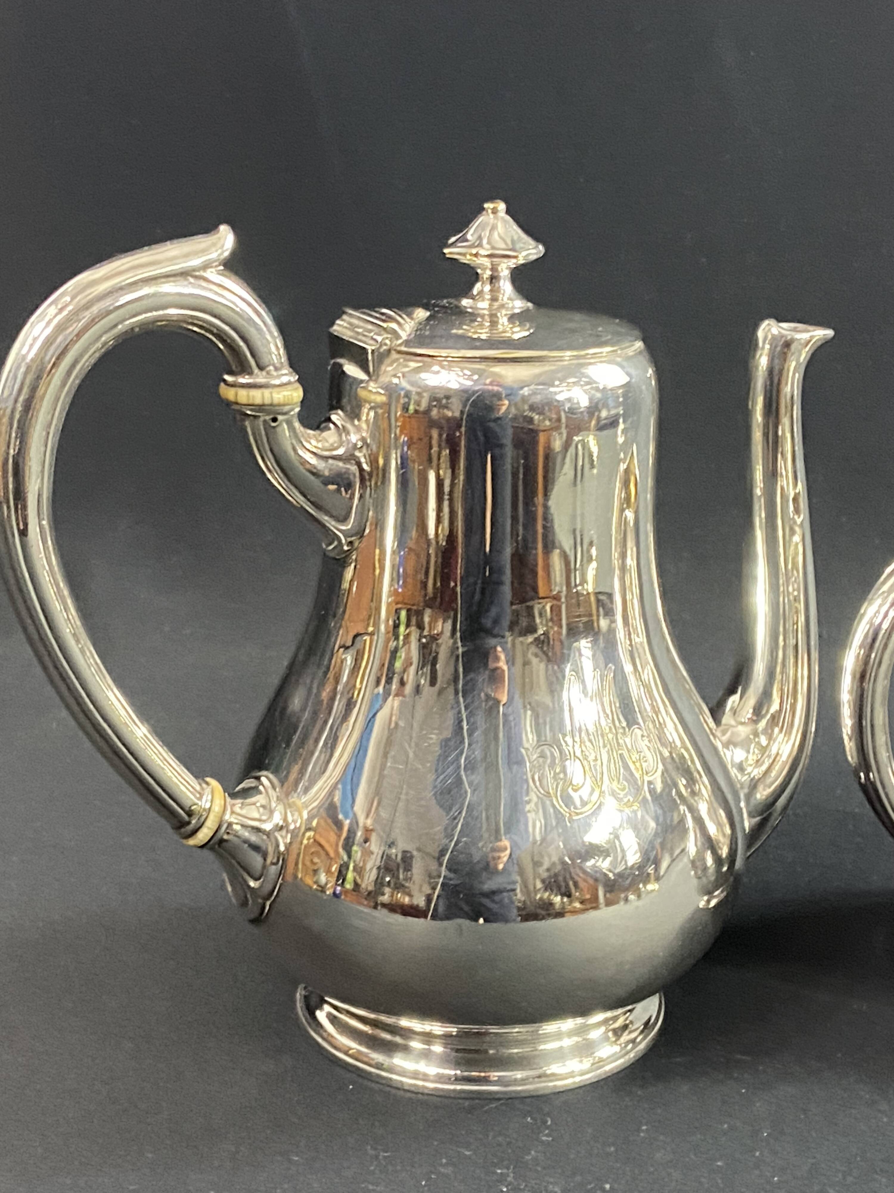 Silver-plated coffee pot and milk jug monogrammed MA, signed CHRISTOFLE.