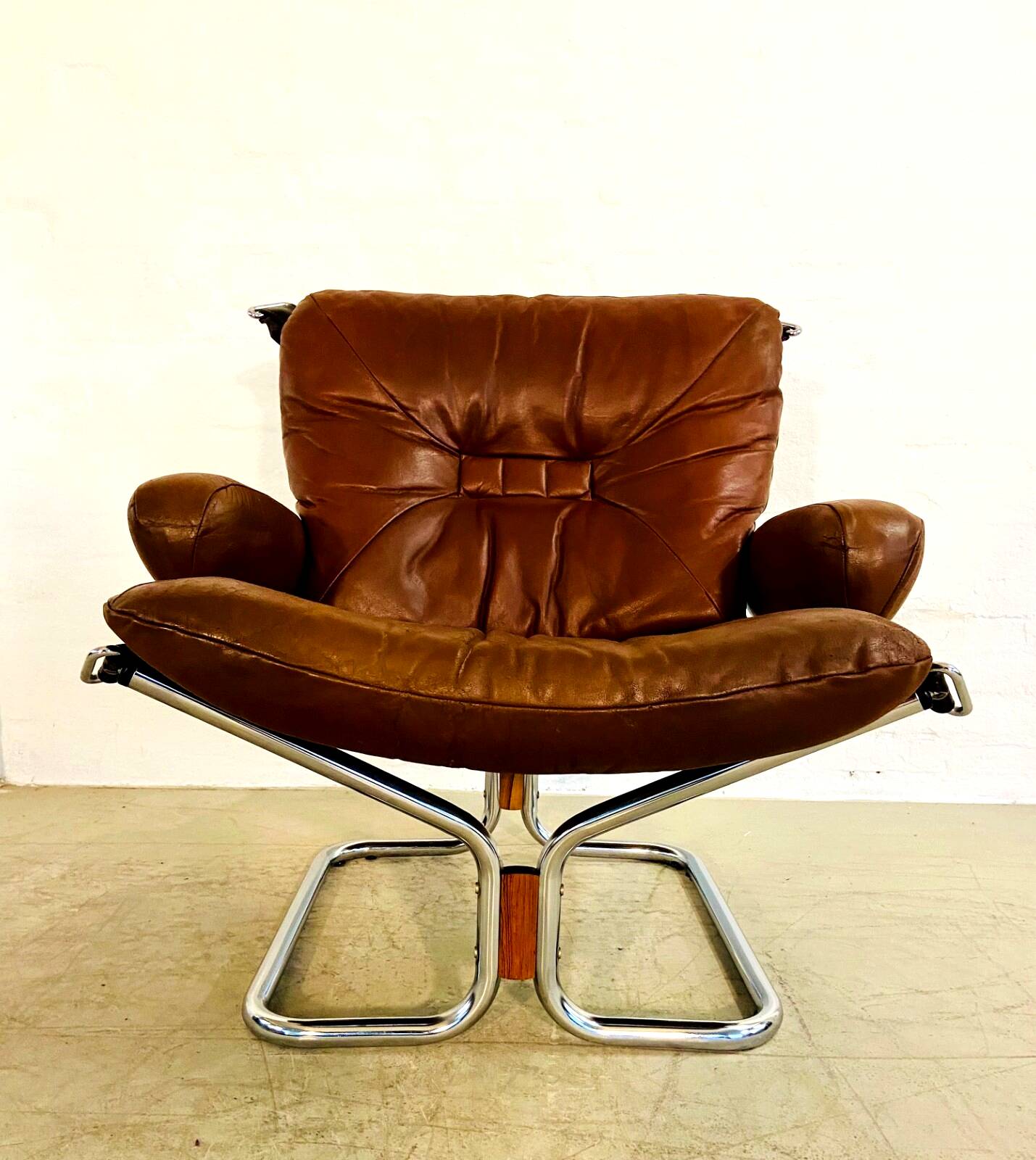 Vintage mid-century Scandinavian cognac leather lounge chair by Harald Relling