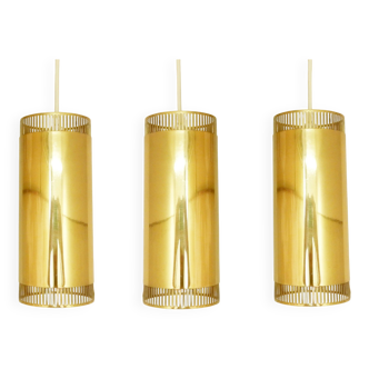Set of 3 perforated brass cylindrical pendant lamps, Sweden 1960's