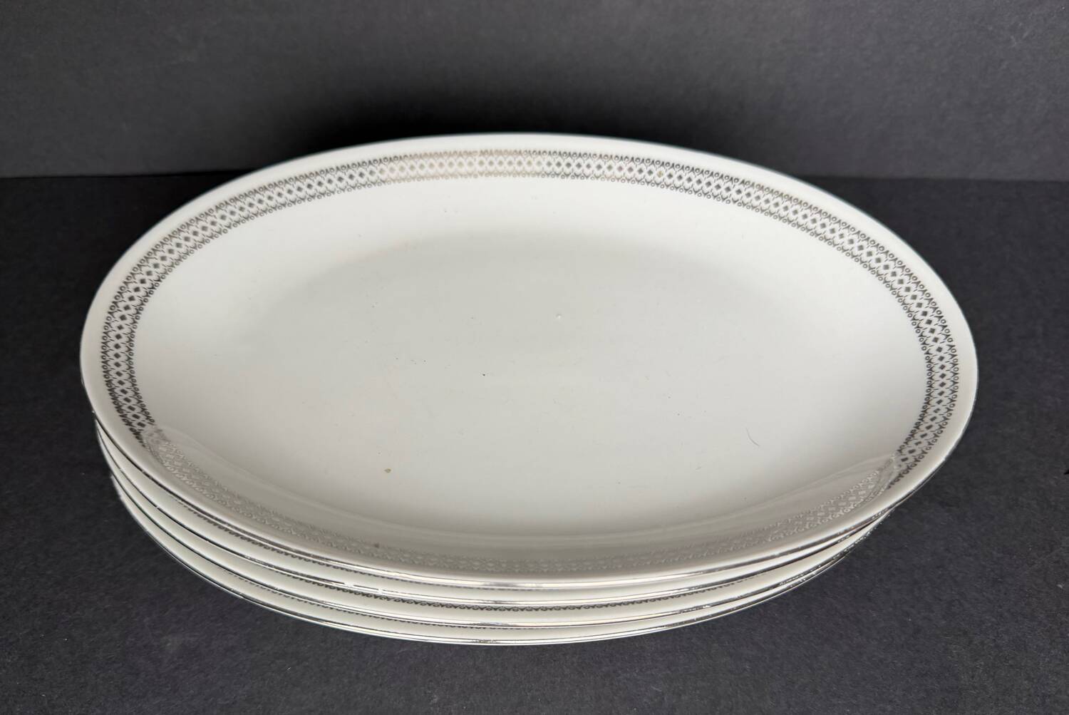 4 small oval porcelain dishes