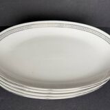 4 small oval porcelain dishes