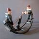 Vintage toy "Painted cast iron clown seesaw" from the 1930s