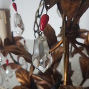 Gold metal chandelier and stamps