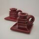 Pair of art deco candlesticks in bordeaux ceramics