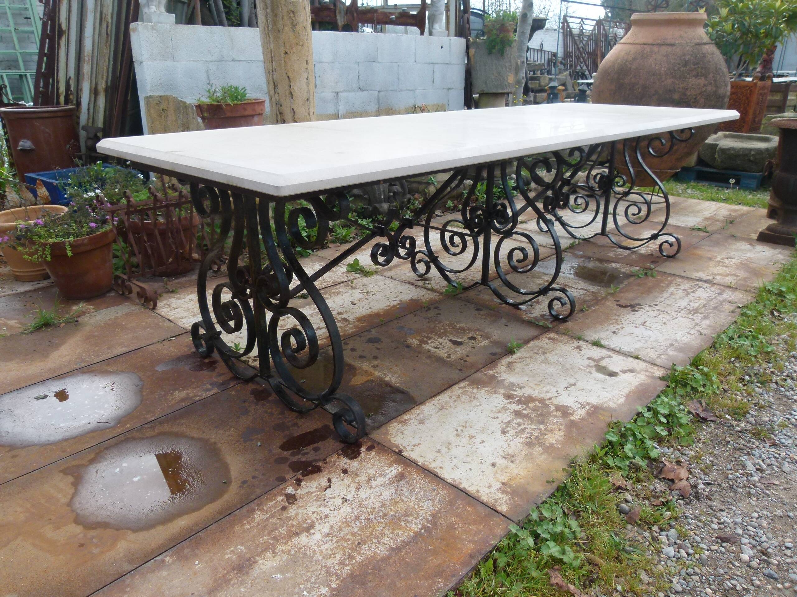 Marble table with wrought iron legs.