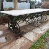 Marble table with wrought iron legs.